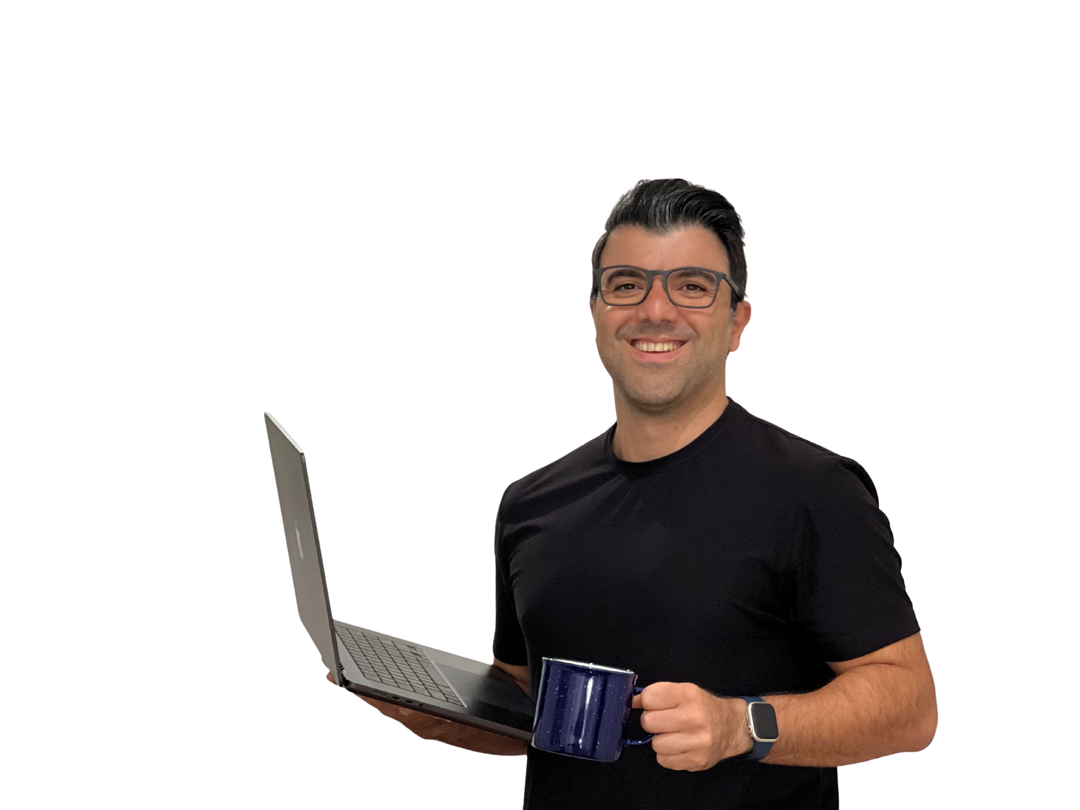 Abe holding a laptop and mug